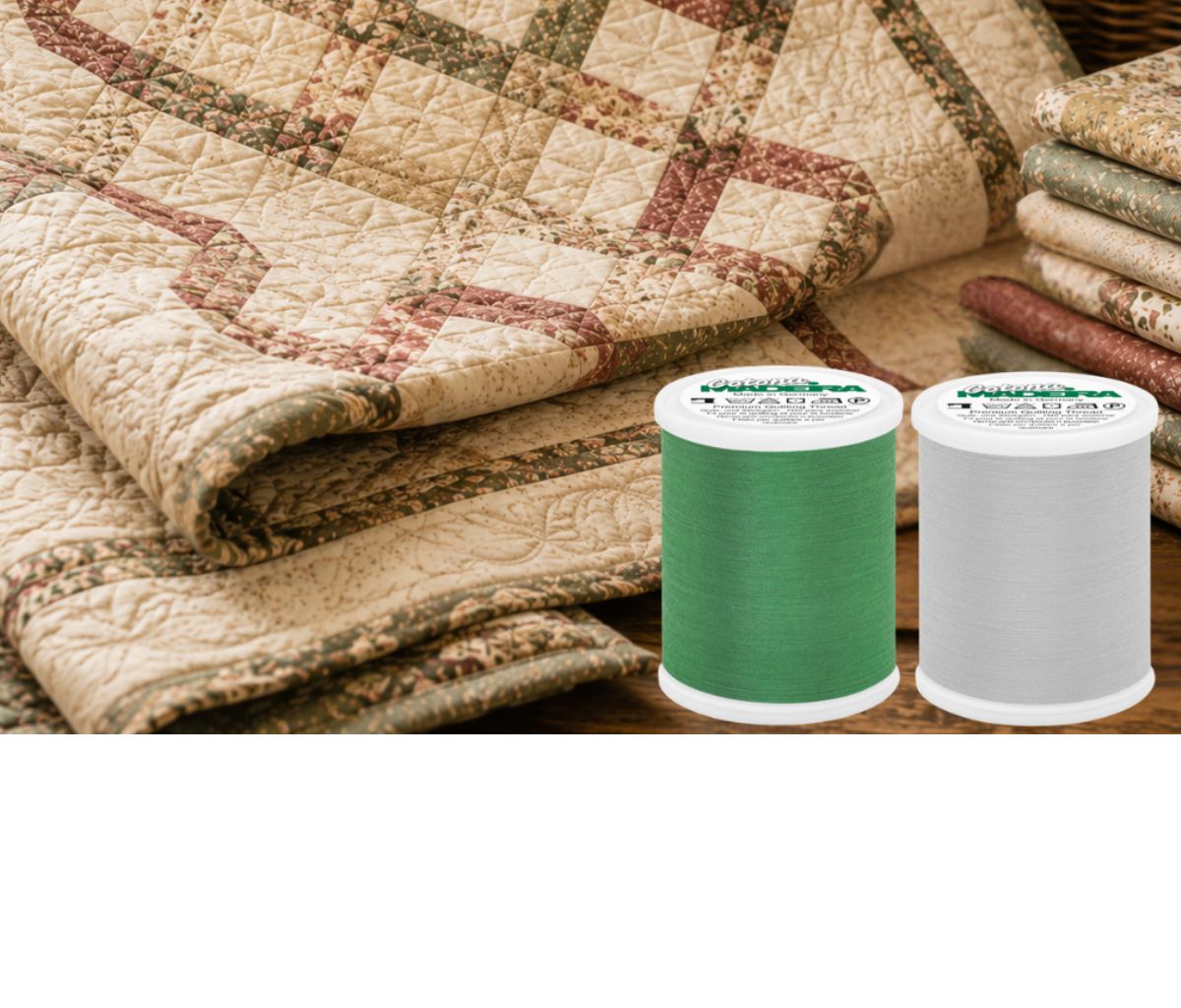 Madeira Cotona cotton quilting thread spools in gray and white, shown with sewing tools and fabric for quilting and sewing projects.