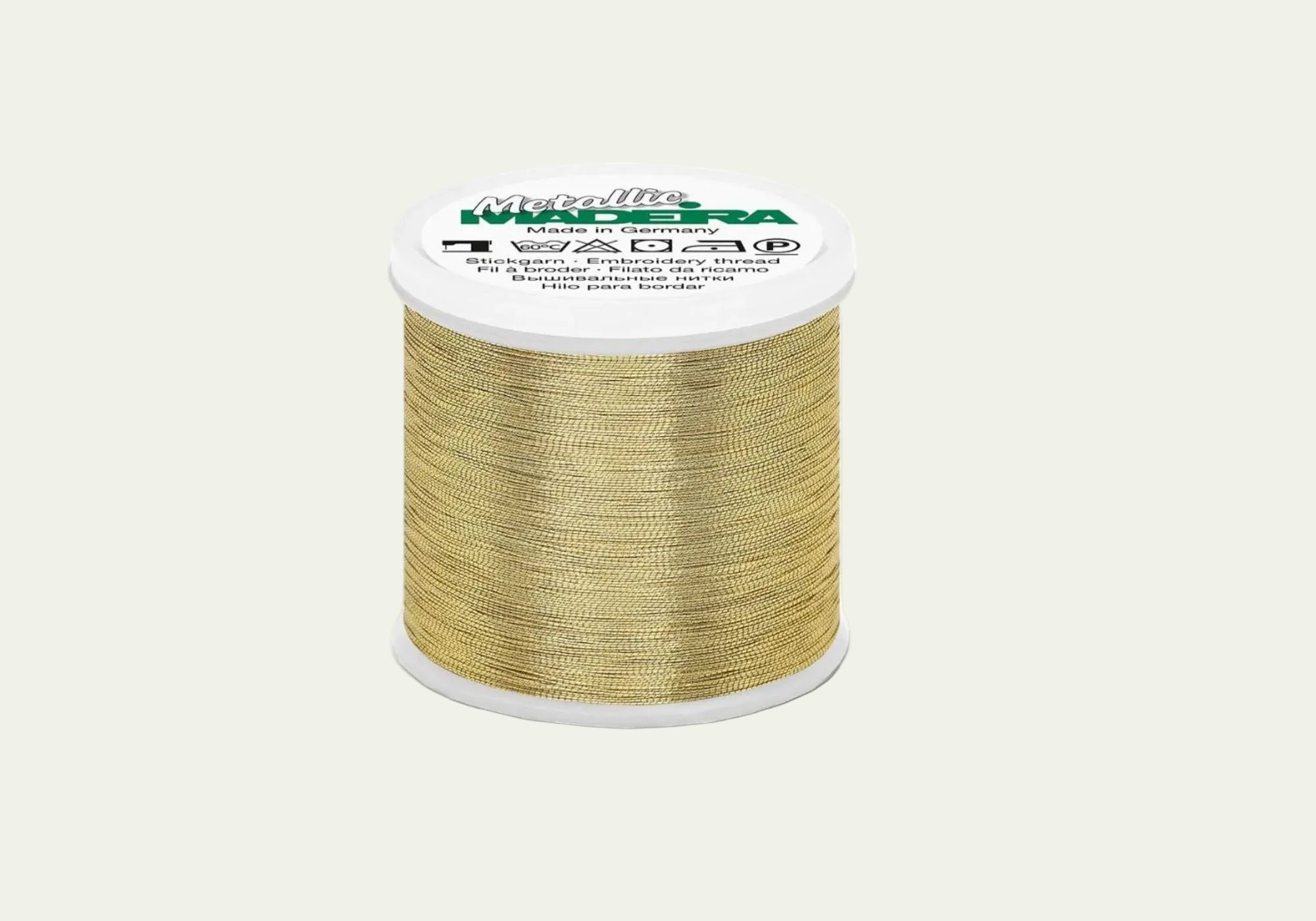 Madeira Metallic gold embroidery thread cone with high-shine metallic finish for machine embroidery, decorative stitching, monograms, and specialty embroidery designs.