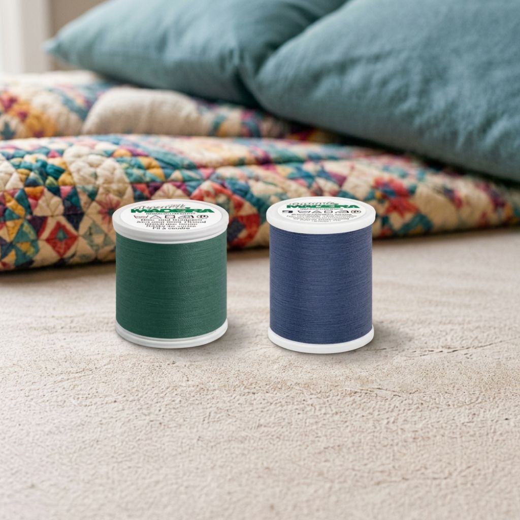 Cotona cotton quilting thread and Aerofil polyester quilting thread shown side by side, highlighting the choice between cotton and polyester thread for quilting projects.